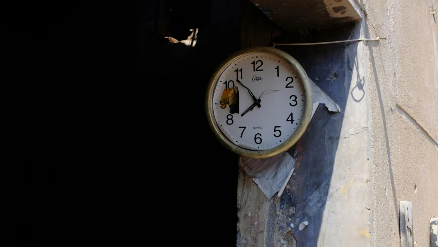 there is a clock that is attached to the building