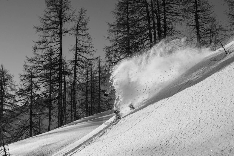 black and white po of a skier skiing down a slope