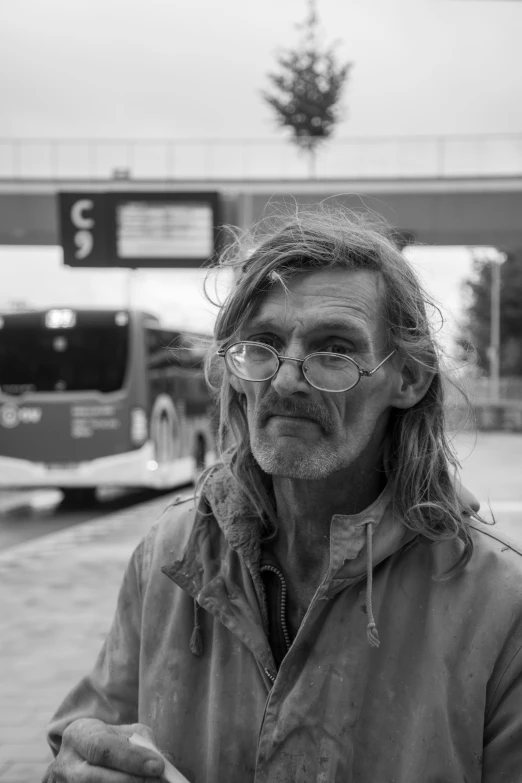 a man is sitting on the street corner