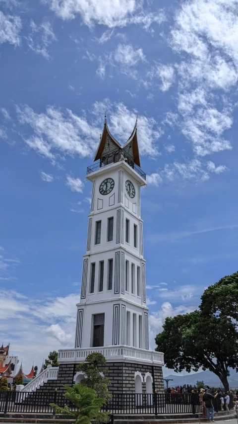 a clock tower that is standing on a sunny day