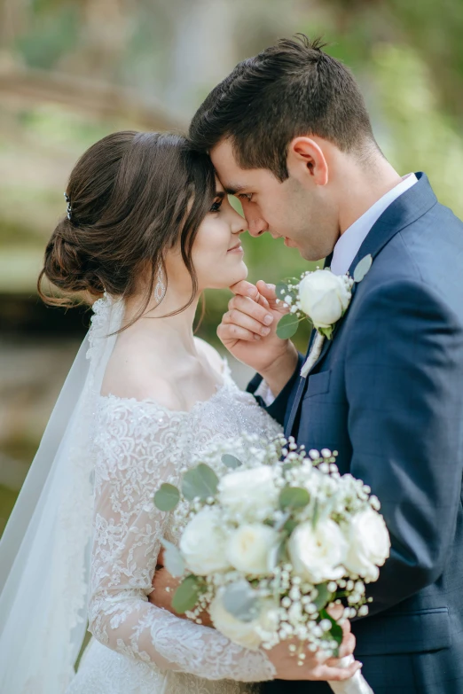 bride and groom with flowers in their hands