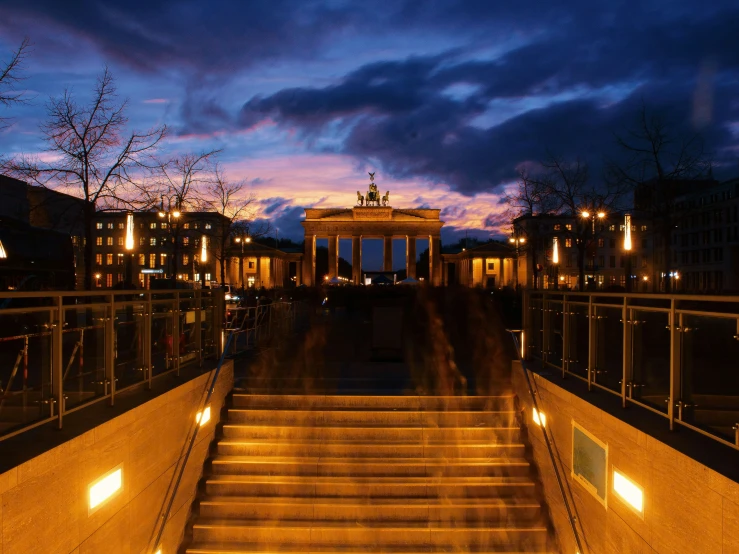 the steps lead to a town with buildings in the background