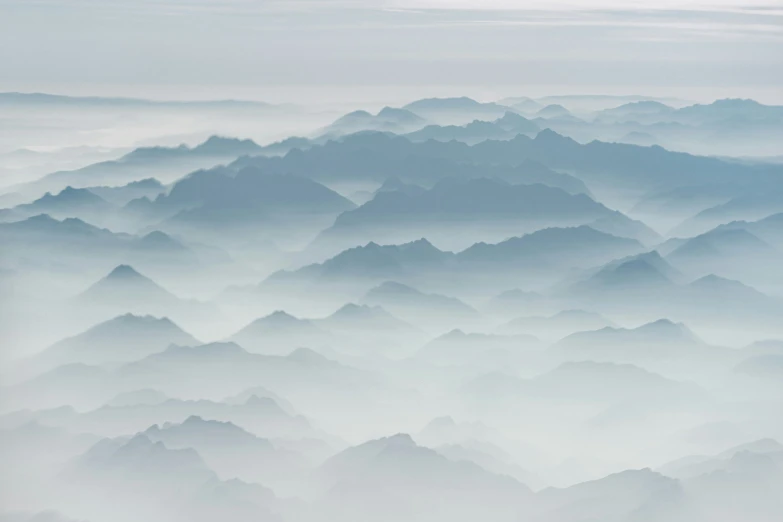 the view from above of mountains and clouds