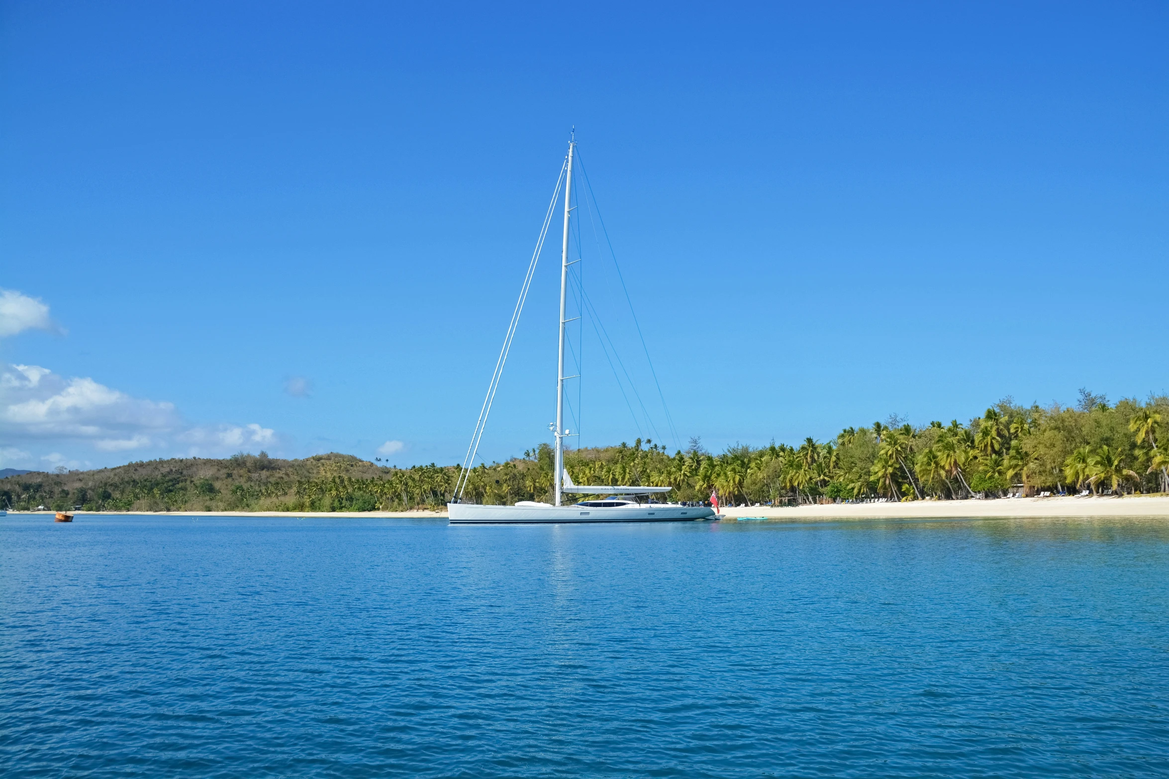 the blue water is next to the shoreline