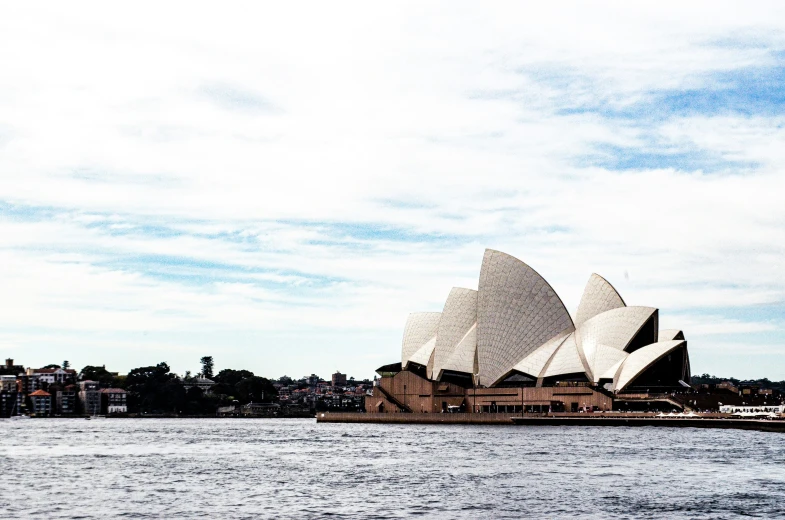 the opera on the sydney river, with a large ship in front