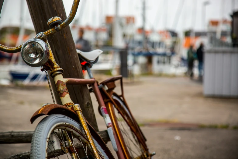 an old bicycle is parked by the dock