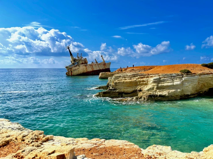 two ships are seen floating on the blue ocean