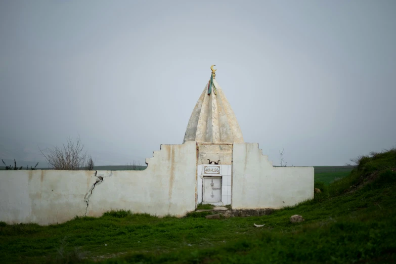 a building with a tall dome sitting on a hill