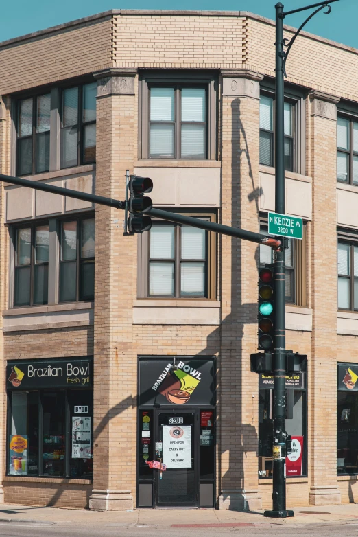 a corner store in an intersection with traffic lights