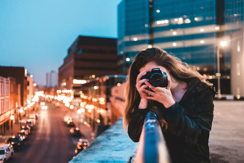 a woman is taking a picture with her camera