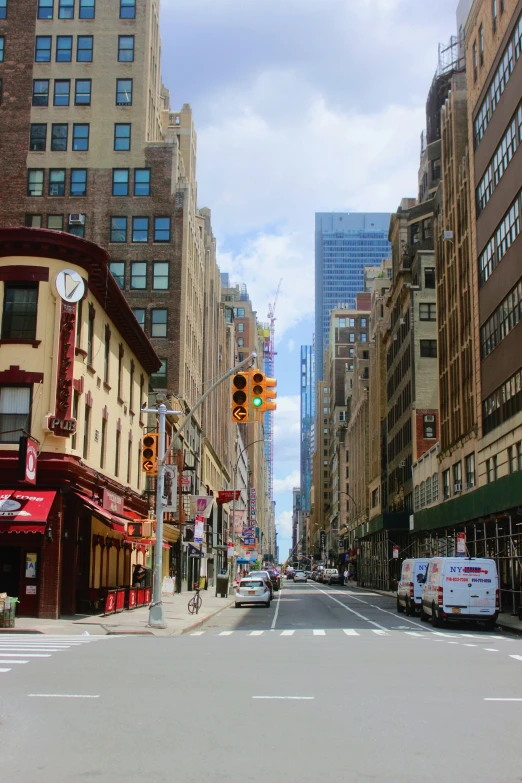 a street with some tall buildings and a traffic light