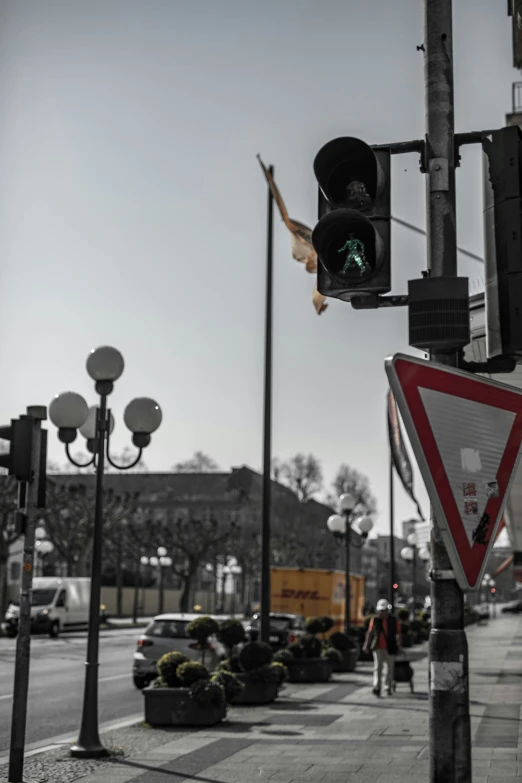 an urban street with some stoplights and people