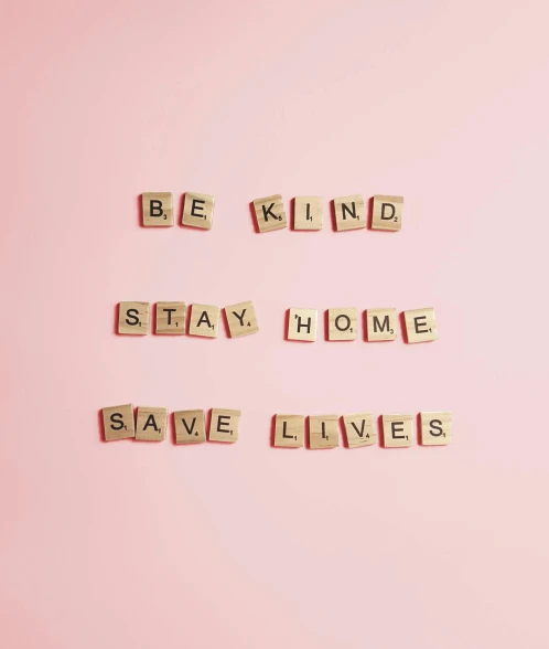 wooden block letters saying be kind stay home and save lives