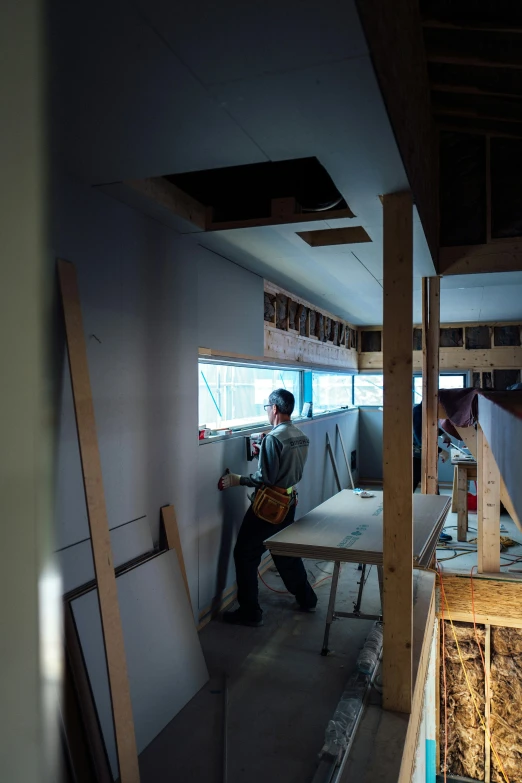 a person standing next to an open doorway in a room