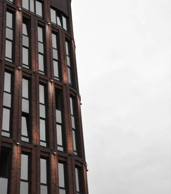 a close - up s of the side of a tall building with lots of windows