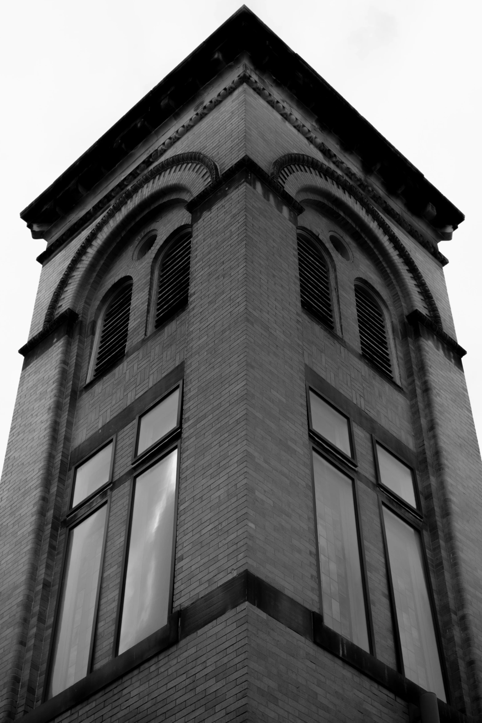 this is an old brick building with multiple windows