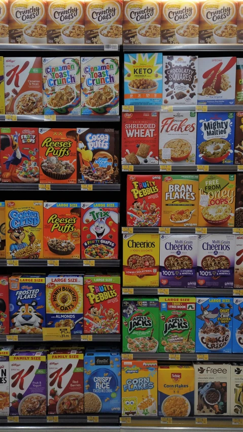 some boxes of cereal in a store shelf