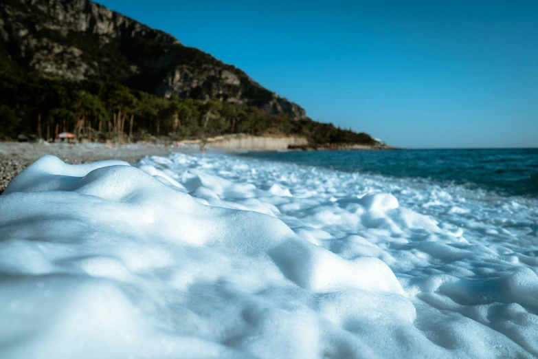 this is snow on the shore of the beach