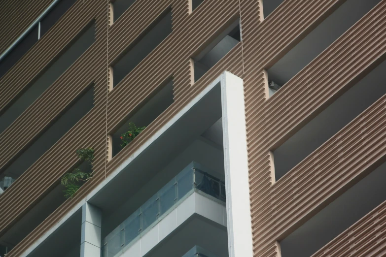 a white building is pictured in front of brown and white