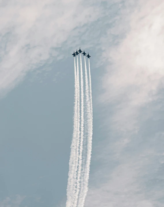 an air craft leaving a long trail in the sky