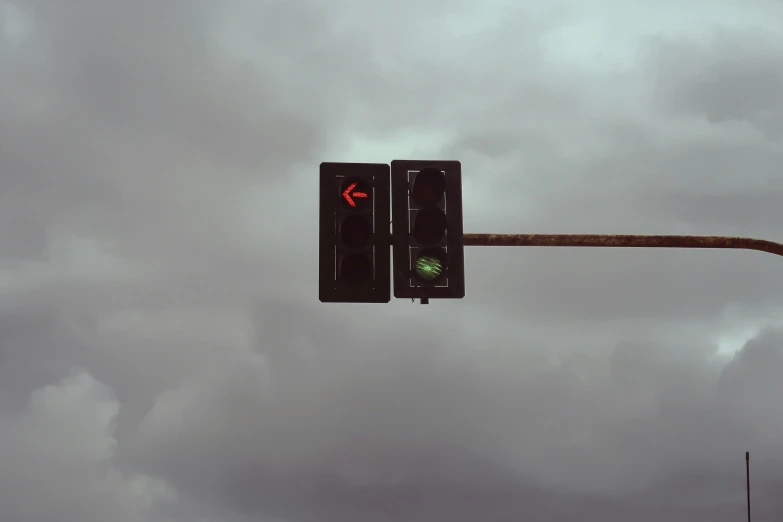 a traffic light with a green light next to a stop sign