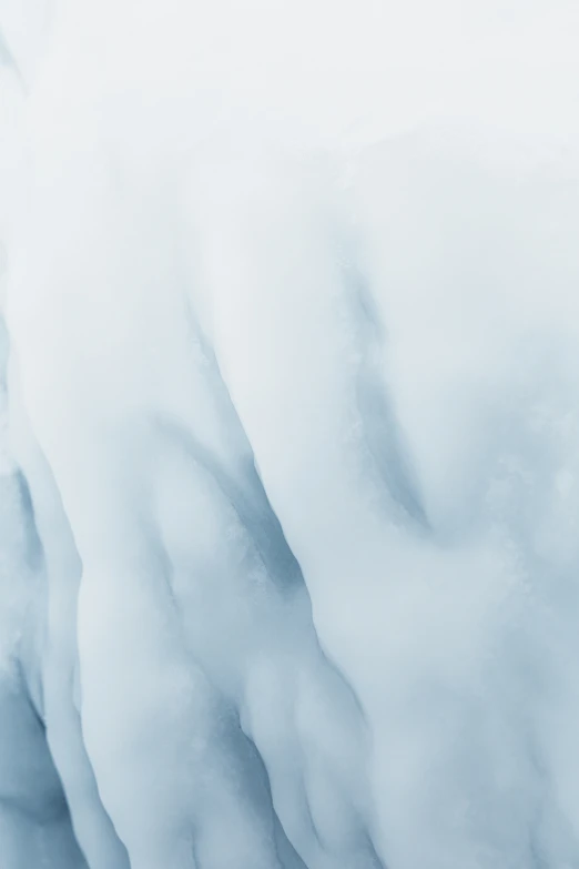 the back end of an airplane flying over the snow