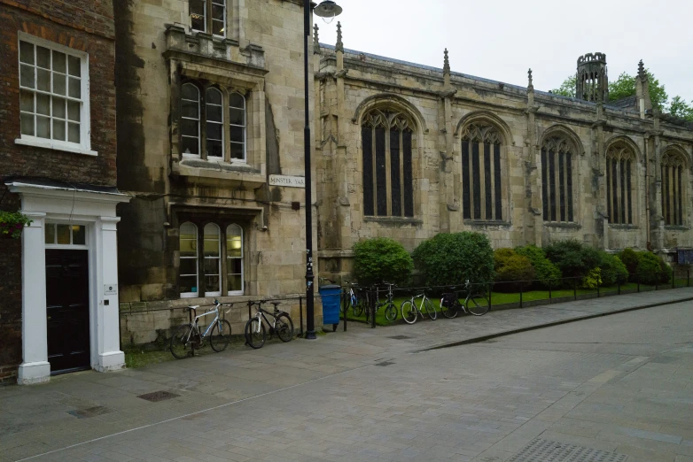 an old, historic building with a few bicycles parked outside