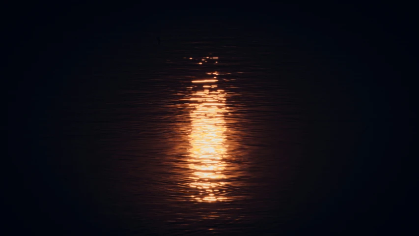 an image of bright moon shining in the ocean