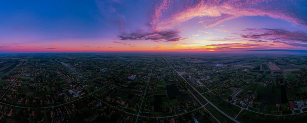 an aerial view of a city and its surrounding landscape