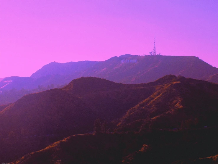 purple hues over some mountains at twilight