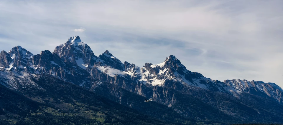 mountains that have snow capped tops and valleys