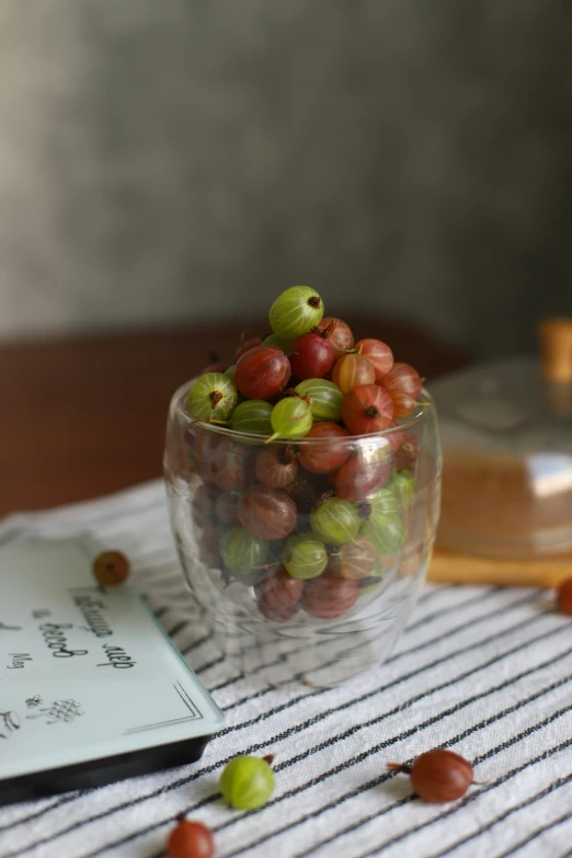 a bowl full of gs with a note in front of it