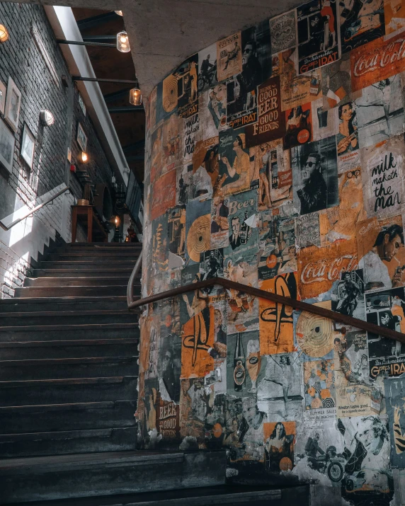 a staircase made from colorful tiles next to a light