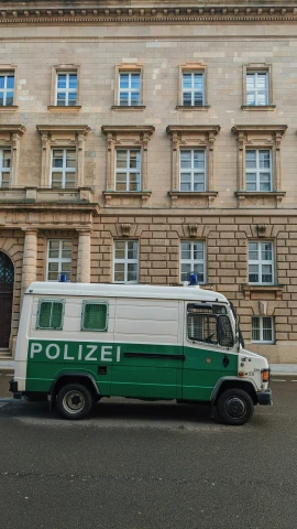 an ambulance parked in front of an old building