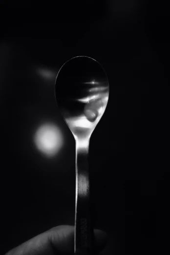 a spoon has been placed on a spoon in the dark