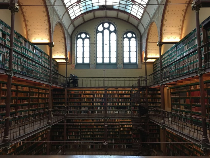 a long narrow hall filled with lots of books