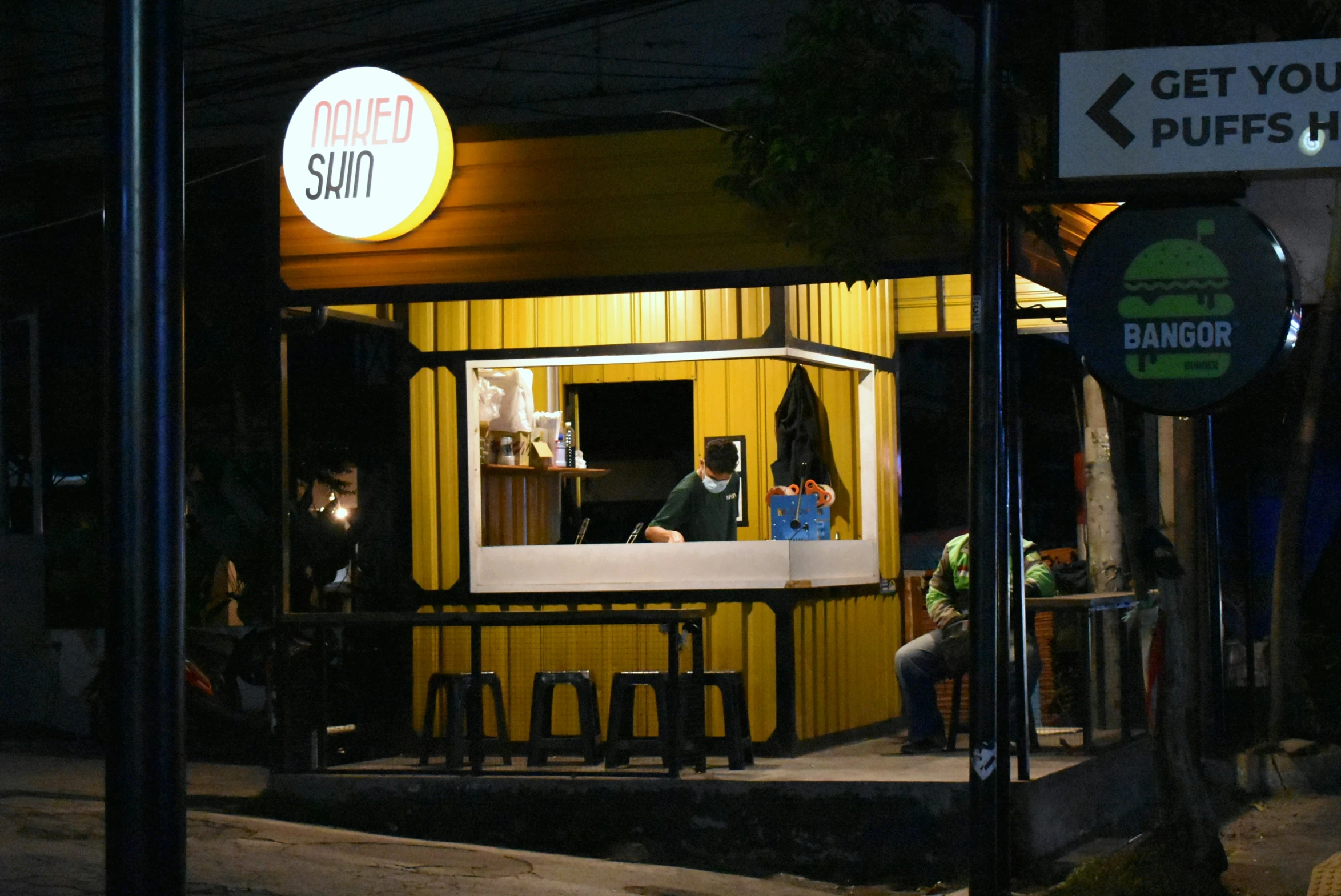 a diner on the side of a building on a city street