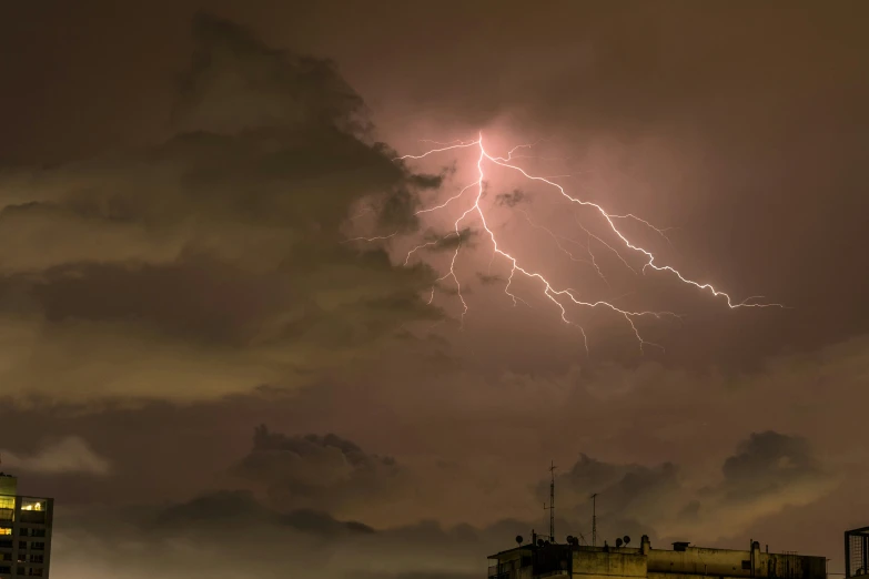 a large cloud with lightning hitting the top