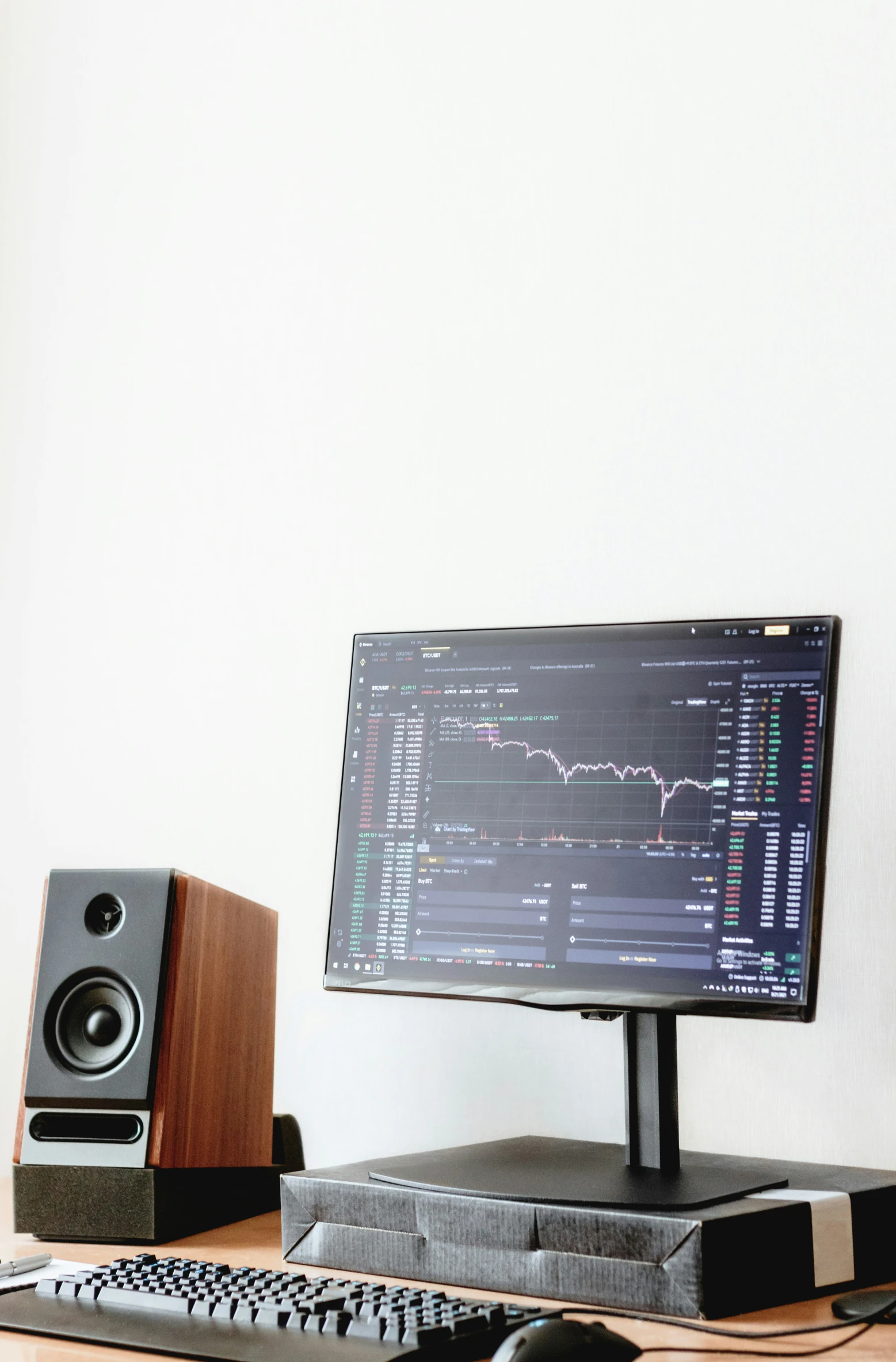 a computer monitor sitting on top of a desk