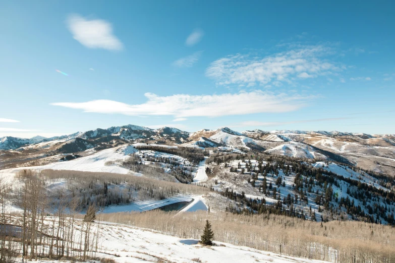 a person riding skis on a snow covered hill