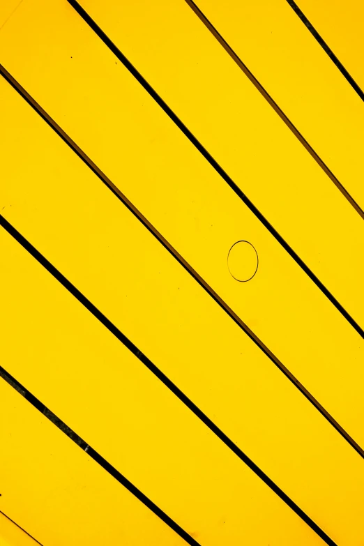 a yellow roof has a round line in the middle
