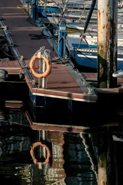 several empty boats docked at pier with the docks in view