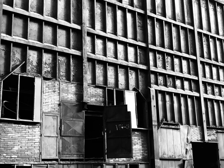 a very big brick building that is next to some windows