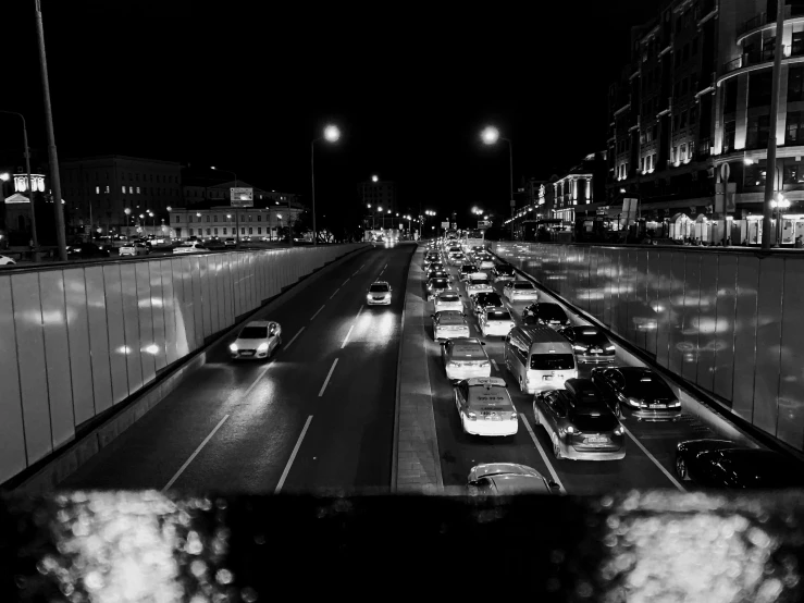 black and white pograph of a night traffic jam in the city