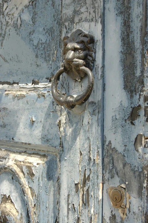 there is an old door handle on an old house