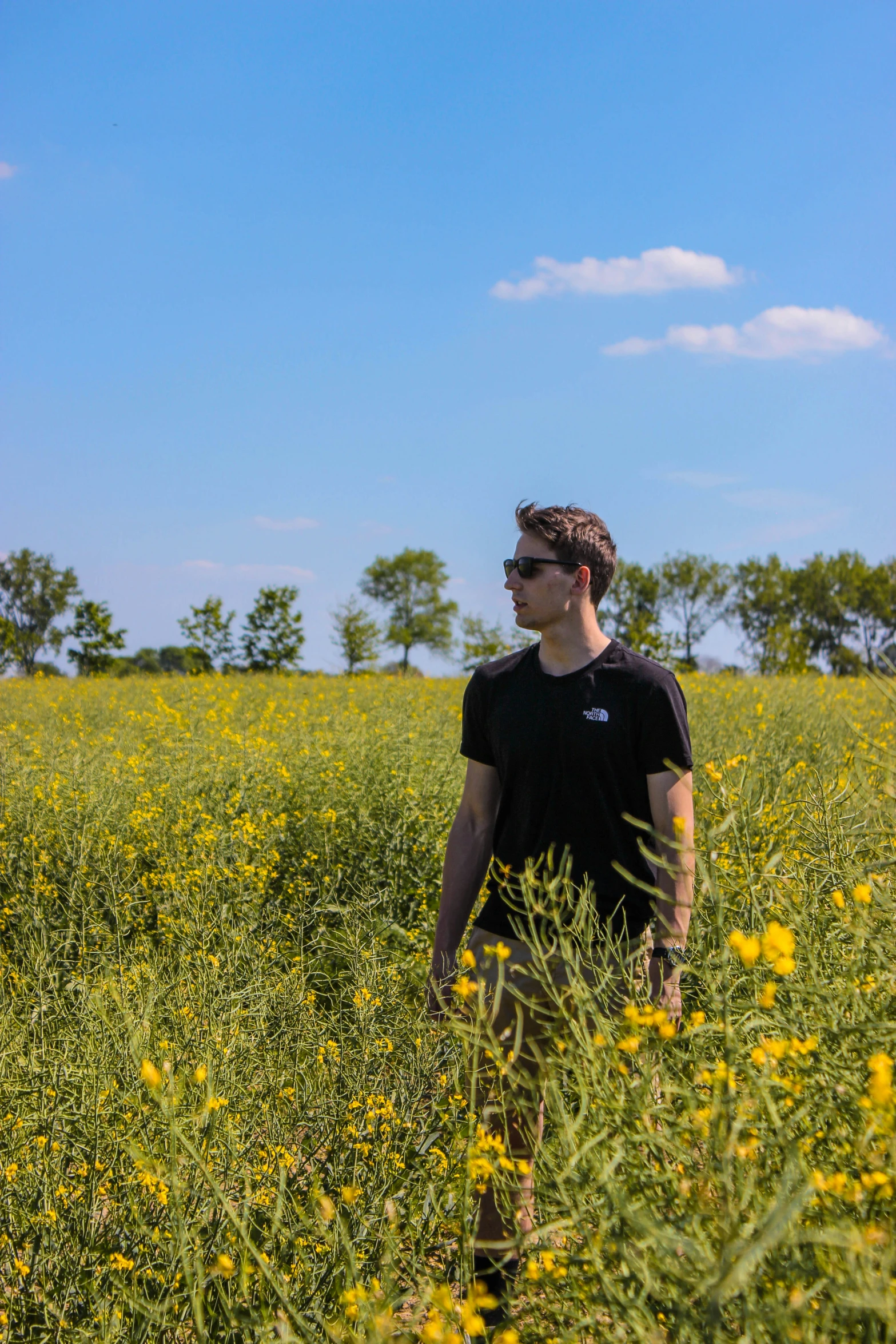 a person that is walking in some tall grass