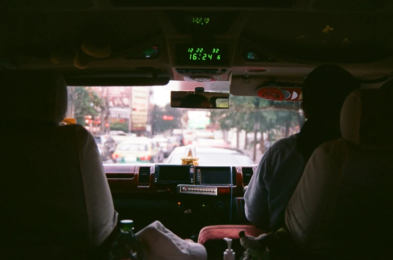 a view from inside a bus looking at people