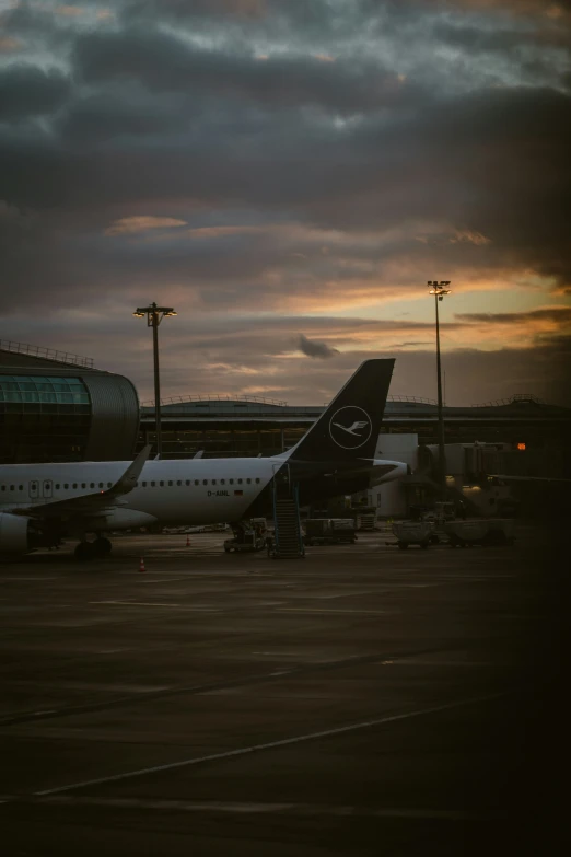 two airplanes are parked in an air port area