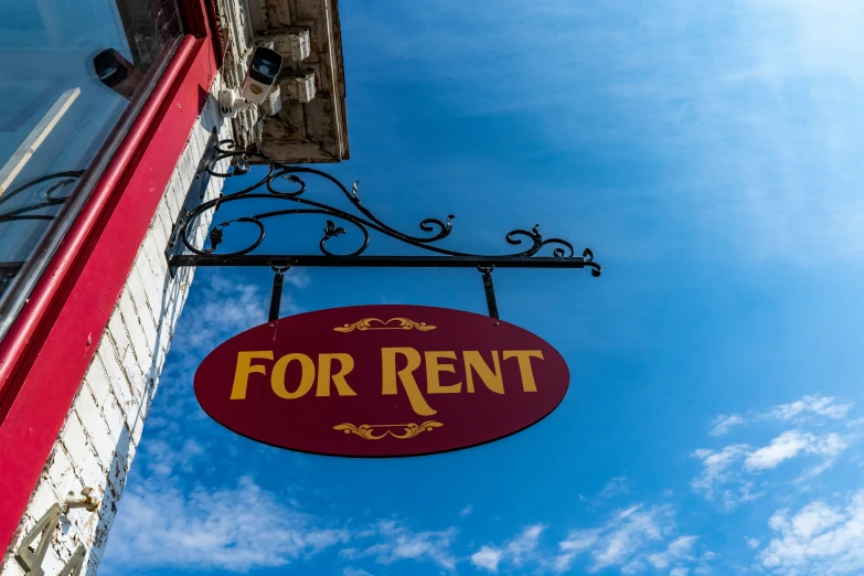 a sign hanging from the side of a building