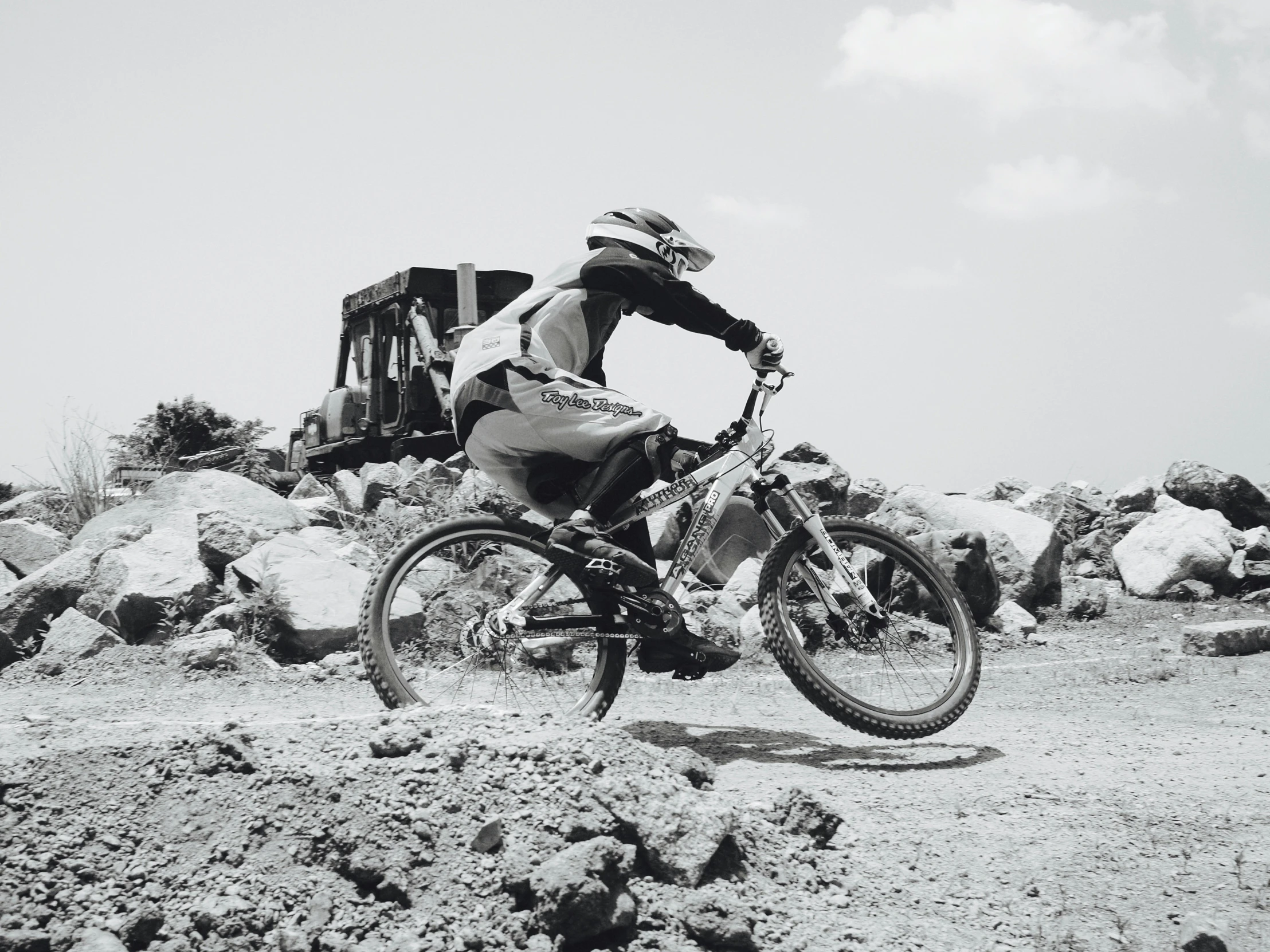 a man riding on top of a dirt bike